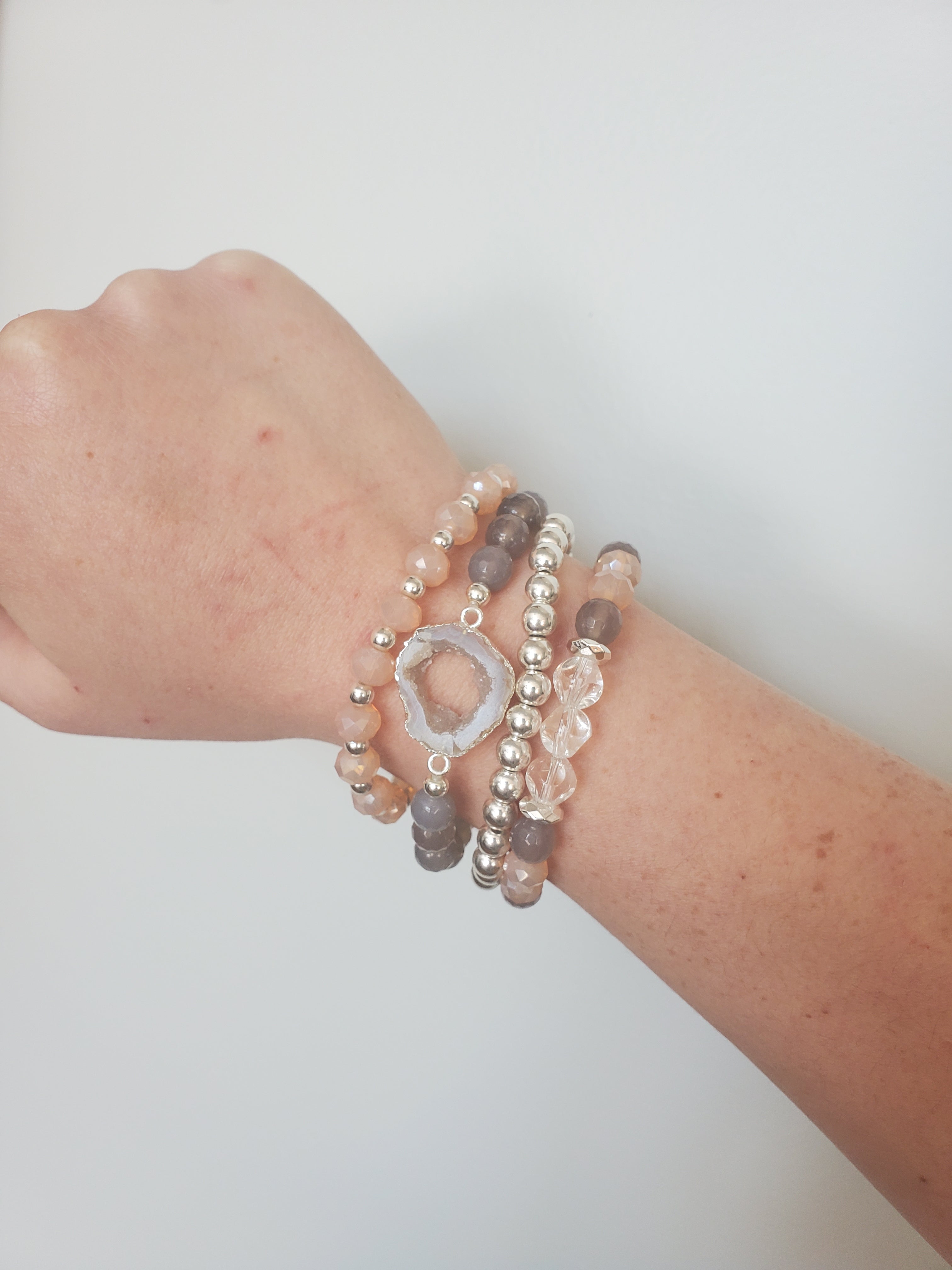 Stacking bracelets by Rock Paper Pretty worn on wrist, connector bracelet, beaded bracelets