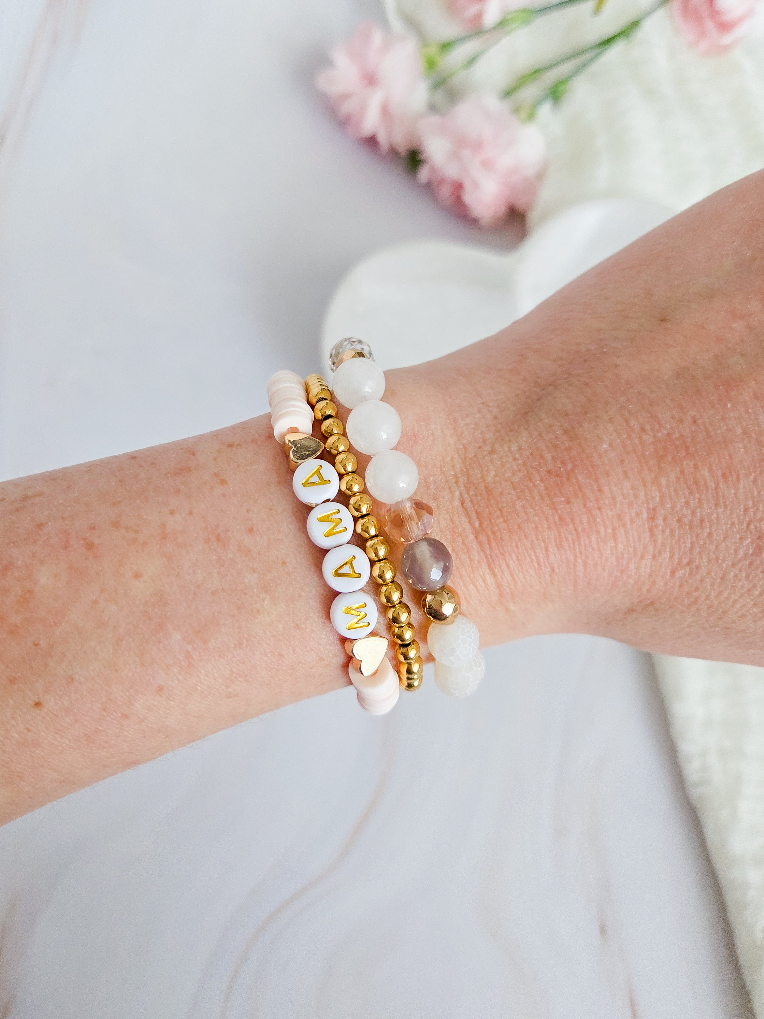 Powder pink personalized mama bracelet with polymer clay heishi beads.