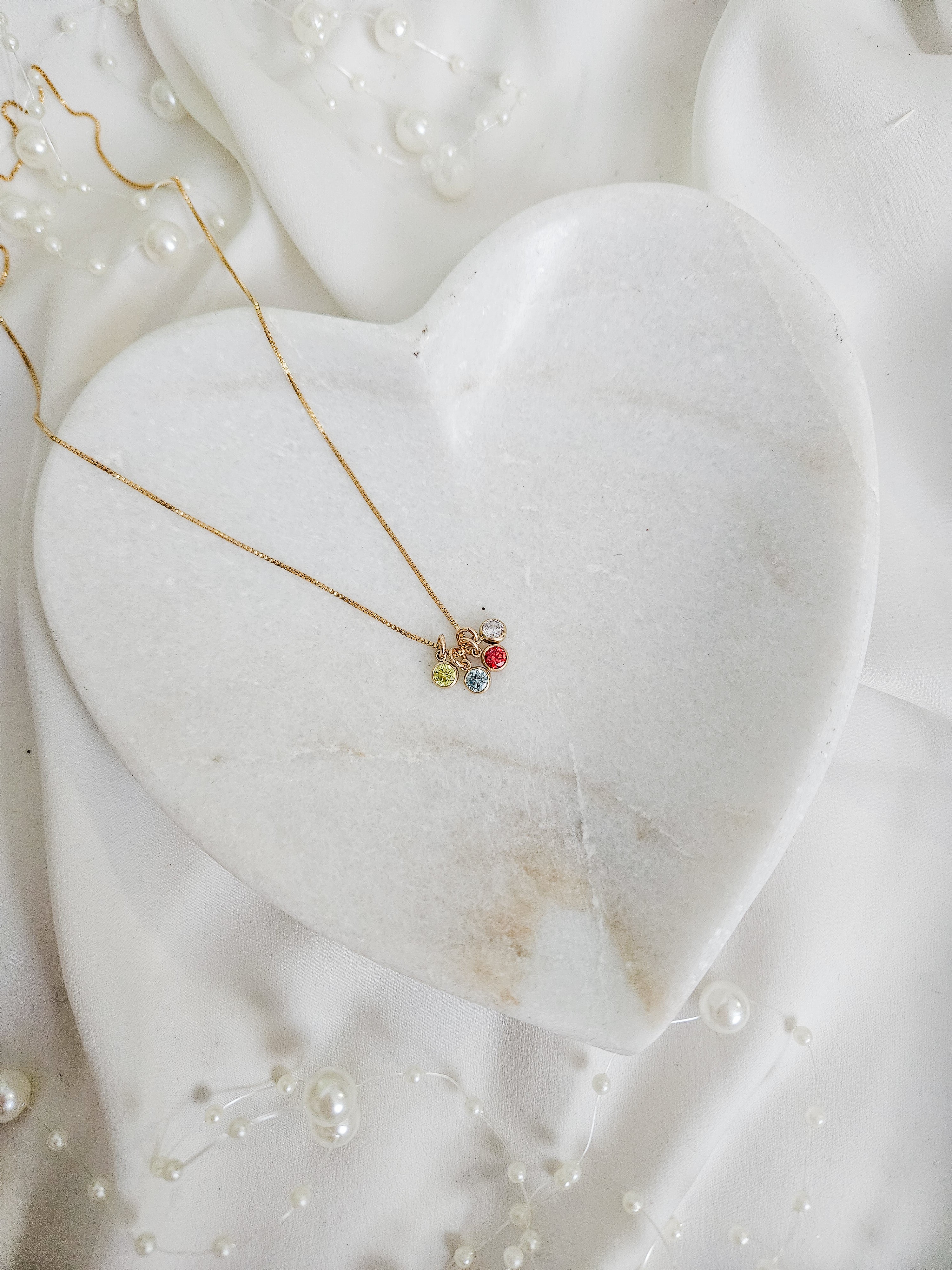 Small CZ birthstone charm on 14k gold filled box chain.