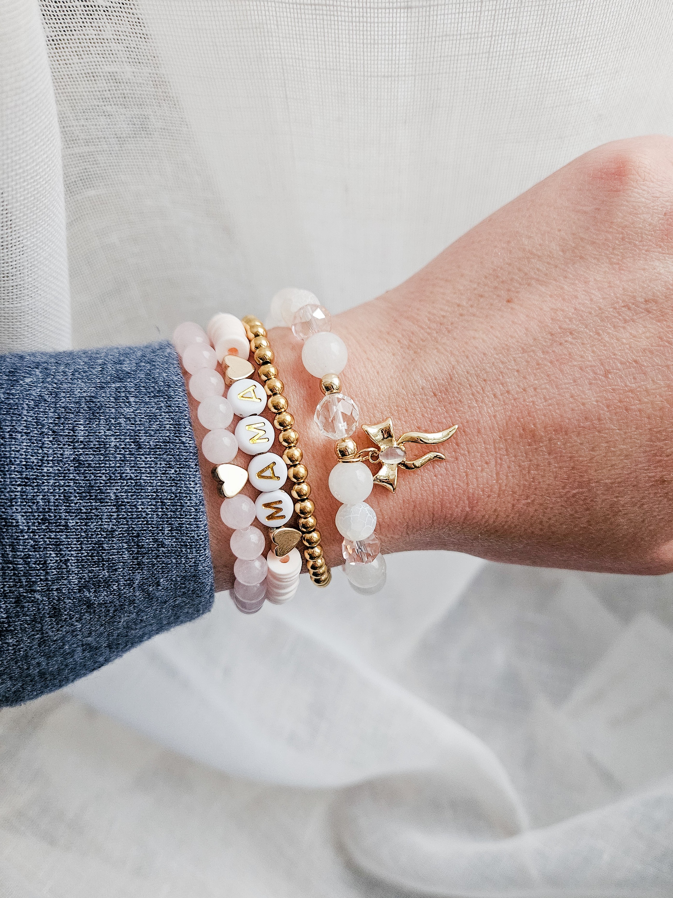 Personalized mama bracelet worn stacked with everyday jewelry