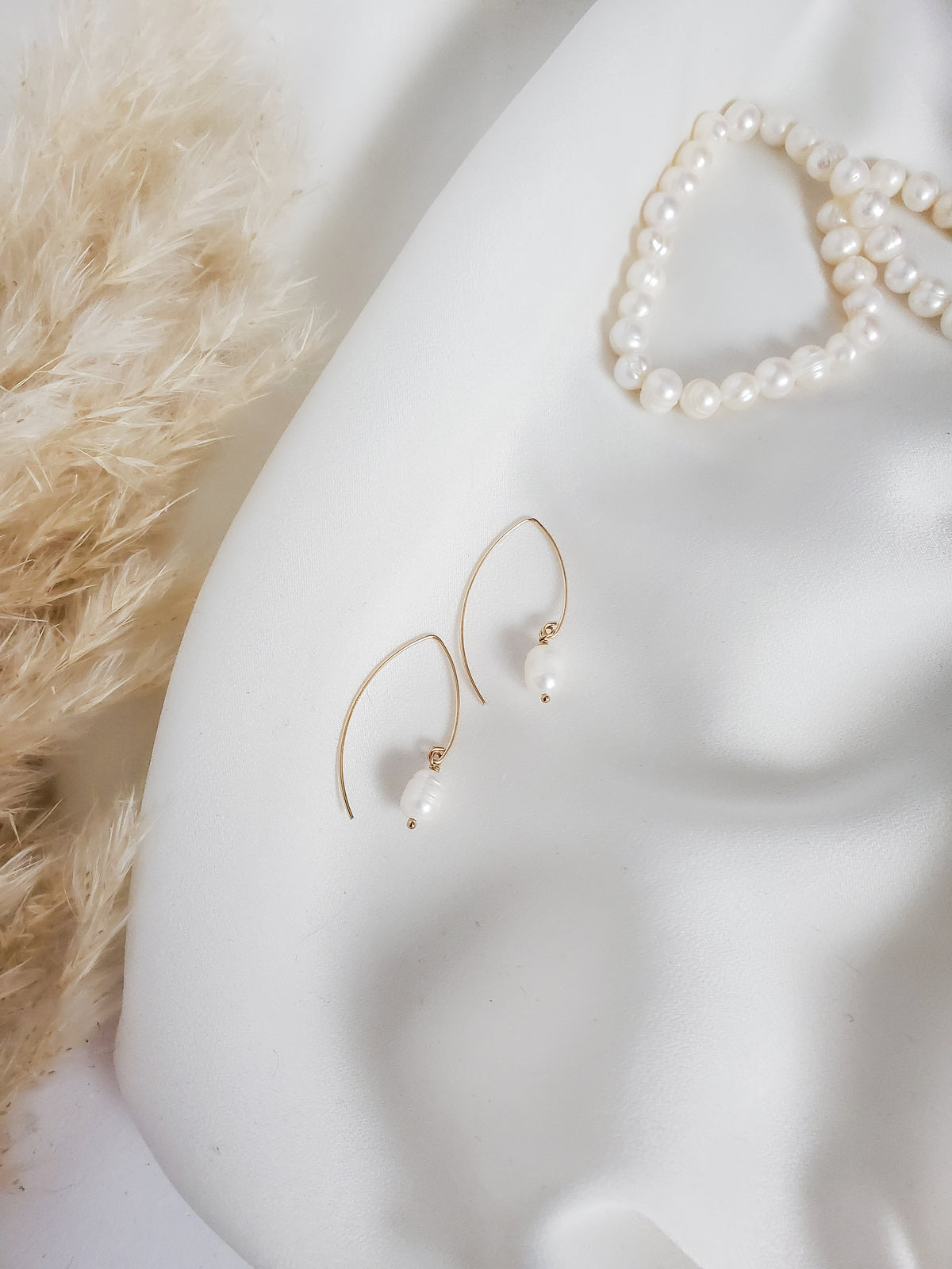 Minimalist gold filled earring hooks with a single freshwater pearl drop