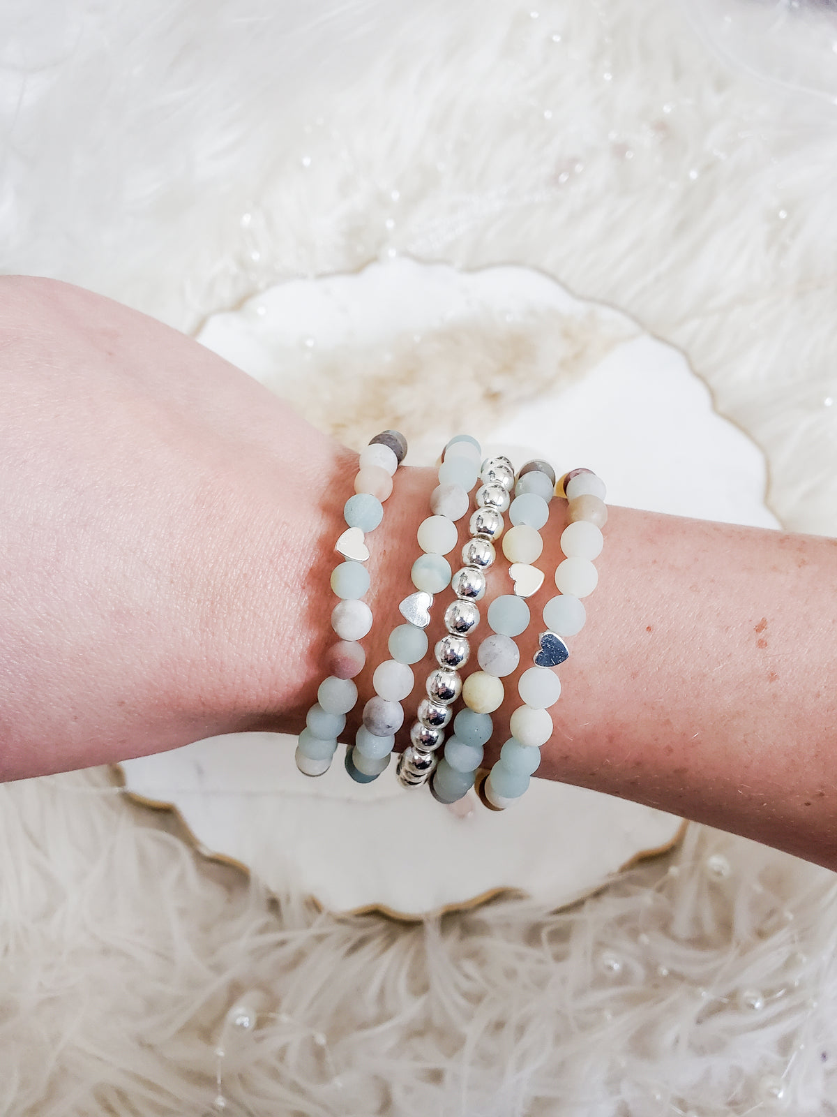 Amazonite and silver beaded bracelet stack on a wrist
